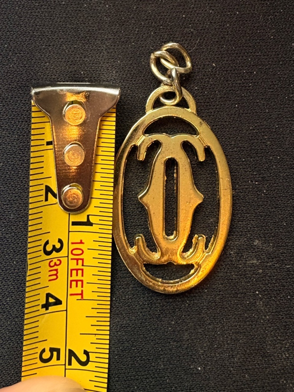 Cartier Gold Tone Oval Logo Pendant Charm